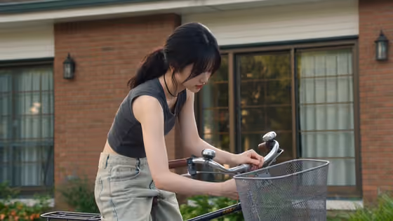 Young Woman Neighborhood Bicycle Ride
