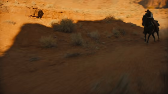 Moody Western Horse Chase At Golden Hour