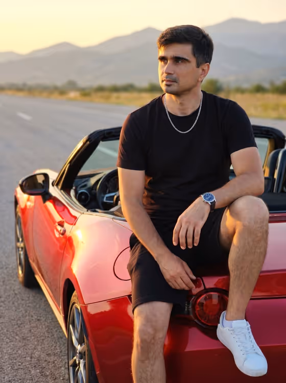 Man on Red Convertible Sports Car